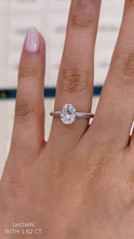 Load and play video in Gallery viewer, Oval Moissanite Engagement ring with knife edge pave band hidden halo in gold

