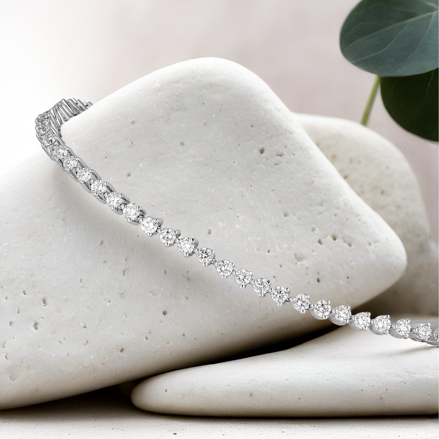 Load image into Gallery viewer, Platinum bracelet with diamonds on a white stone surface
