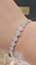 Load and play video in Gallery viewer, Lucce Carla Tapered Tennis Bracelet 4.20CTW DEF VVS Lab Diamond Platinum
