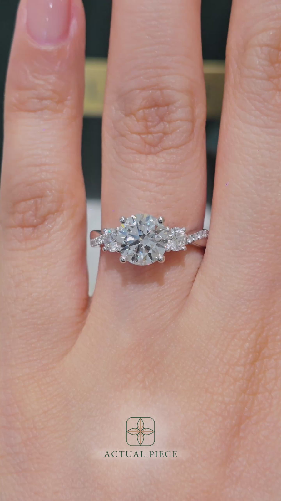 Load and play video in Gallery viewer, LUCCE Twisting Pavé Round Trilogy Diamond Engagement Ring with Petal Prongs in Gold or Platinum
