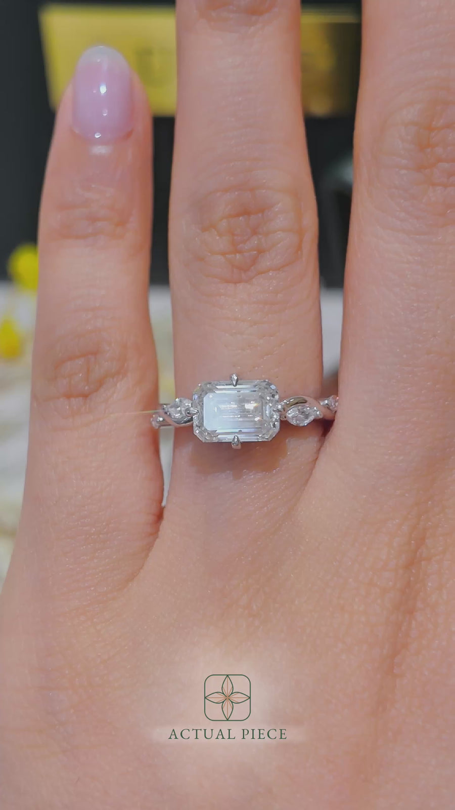 Load and play video in Gallery viewer, LUCCE Emerald Diamond Engagement Ring on East-West Low Setting with marquise accents in Gold or Platinum
